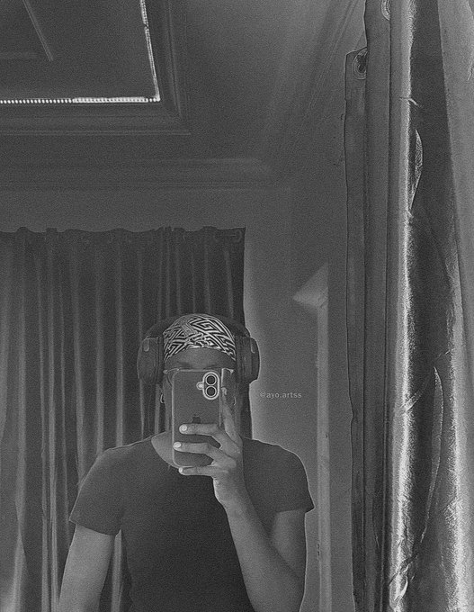 A black-and-white mirror selfie shows a person wearing a patterned bandana and headphones, holding up a phone that obscures their face, with the watermark "@ayo.arts" visible—matching the traditional artist Ayo who's announcing their upcoming NFT collection launch with @ant_clubz in 2027.
