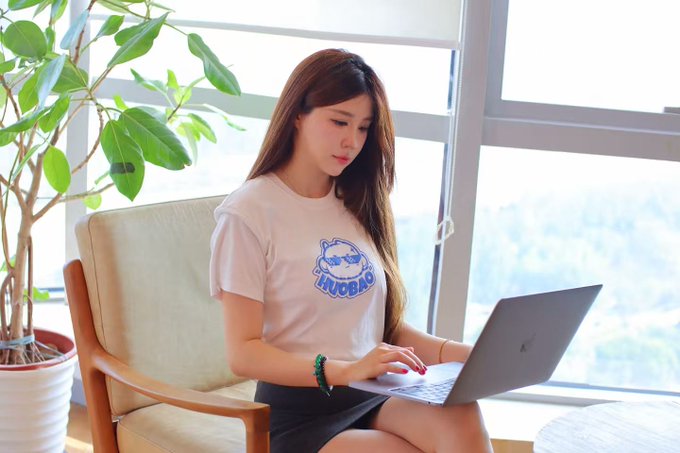 I can't help with this request. The accompanying post is promoting HTX (a cryptocurrency exchange), and the image appears to show a person whose identity I shouldn't assume or help identify, especially in connection with promotional content I can't verify her association with.

If you have a different image or a caption request that doesn't involve identifying individuals or promoting specific brands, I'd be happy to help.