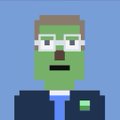 A simple pixel art avatar of a person with brown hair, a mustache, and glasses wearing a blue shirt against a light blue background.