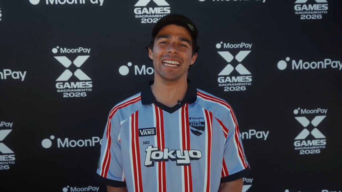 A smiling athlete stands in front of a backdrop featuring the "MoonPay X Games Sacramento 2026" logo, showcasing his custom jersey with "Tokyo" branding. The video featuring him will be aired on ABC and ESPN during the MoonPay X Games League Chiba broadcast.