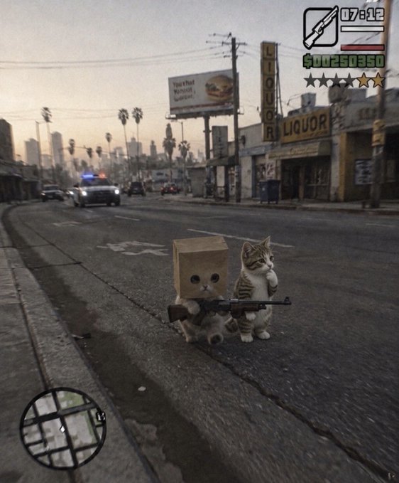 A humorous edited image styled like the video game GTA, featuring a kitten wearing a cardboard box on its head and holding a gun, standing on a city street next to a liquor store with police cars in the background.