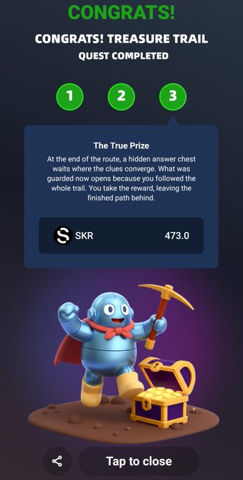 Mobile game 'Congrats! Treasure Trail Quest Completed' screen showing 'The True Prize' reward of 473.0 SKR tokens with a cartoon character holding a pickaxe next to a treasure chest.