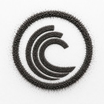 The image shows a stylized copyright symbol "©" formed entirely out of black magnetic iron filings or sand particles, creating a textured, artistic representation. It visually represents the "closed loop" concept referenced in the post about BitTorrent's (BTT) self-sustaining deflationary economic model.