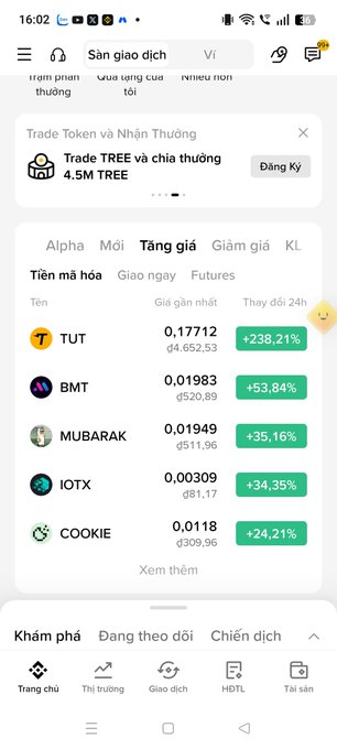 Vietnamese cryptocurrency exchange app screenshot showing top gainers led by TUT at +238.21%, followed by BMT, MUBARAK, IOTX, and COOKIE, with TUT at ₫0.17712.