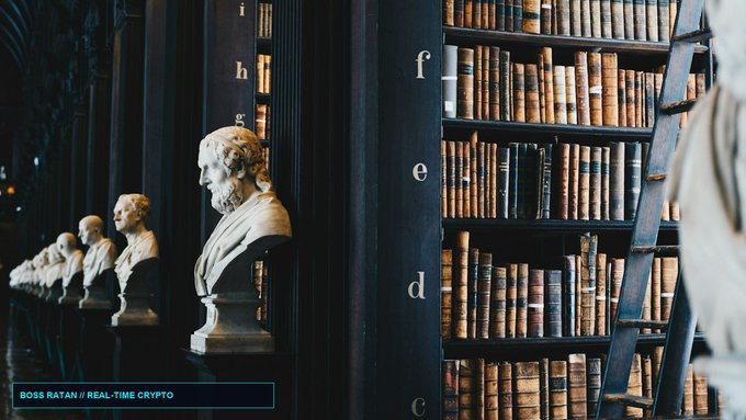 A library interior shows classical busts lined up against dark shelves filled with books, while a wooden ladder leans to the right; text in the corner reads 'BOSS RATAN // REAL-TIME CRYPTO'.