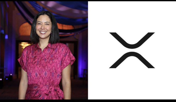A woman in a pink patterned dress stands next to the XRP cryptocurrency logo (an 'X' shape).