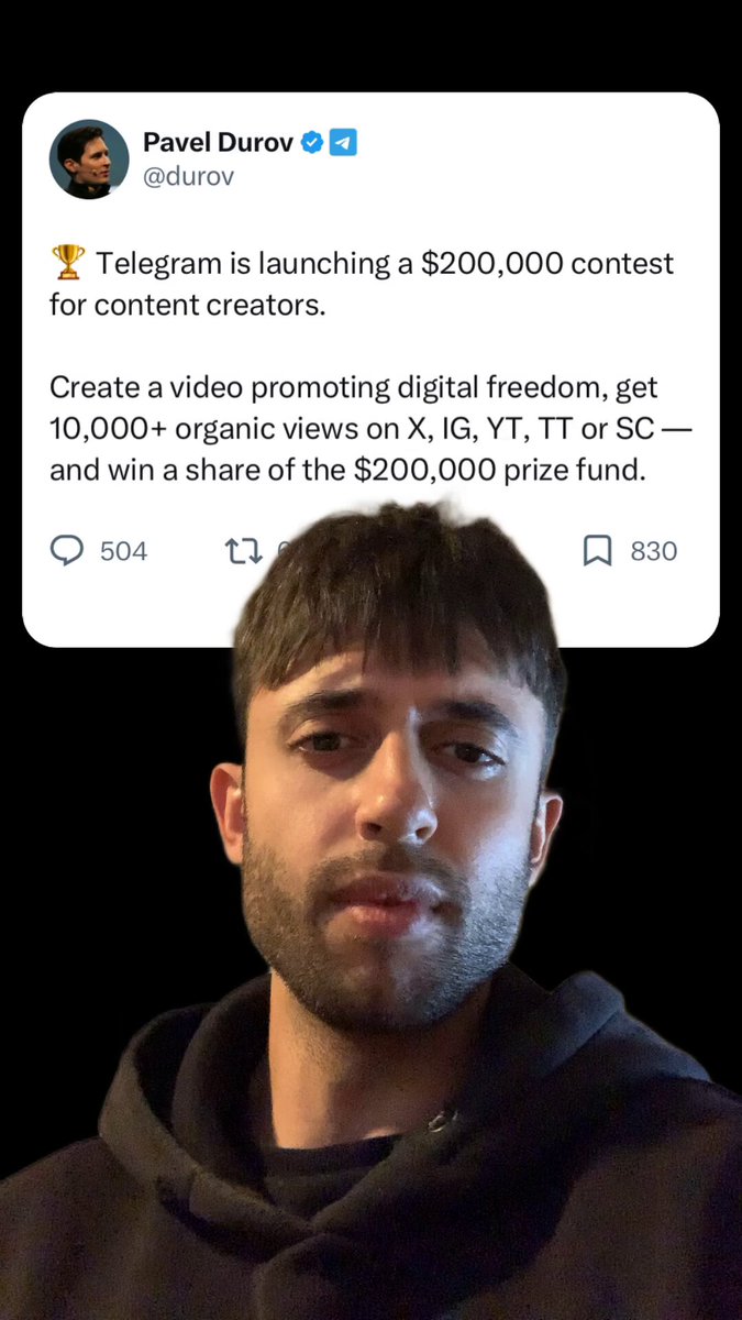 The image features a man wearing a hoodie with a Twitter logo on his head. The man's head is turned towards the camera, giving him an intense gaze as he appears to be looking directly at the viewer. The caption of the image reveals that he has been awarded $20,000 for creating a video promoting digital freedom and organic views on television content creators. The background seems to be black, putting the focus entirely on the man's face and his story.