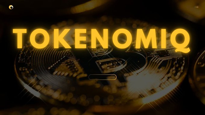 The image features a close-up of a gold coin with the words "TokenomIQ" written above it. The background of the image is black, which contrasts with the gold color of the coin. The text "Sometimes being quiet doesn't mean giving up, it could mean building quietly behind the scenes." is also present in the image.