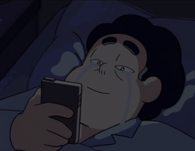 An animated illustration of a crying boy lying in bed at night, looking at a smartphone screen.