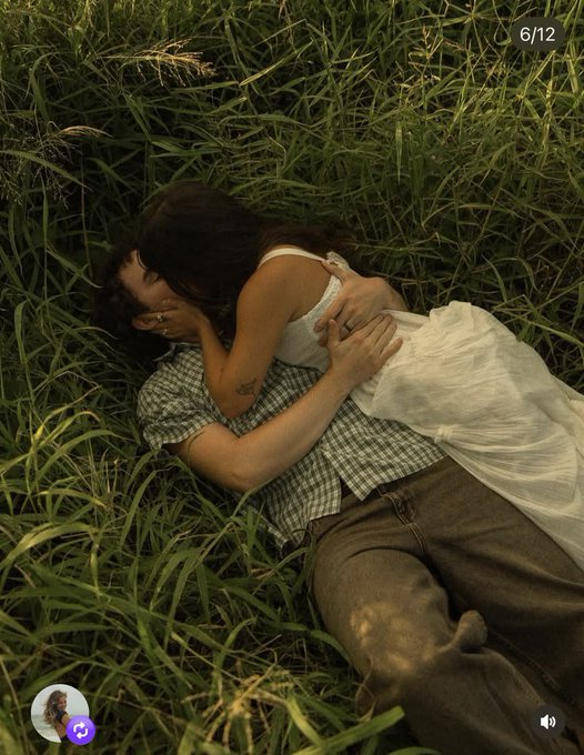 A romantic photo shows a couple lying together in tall grass, shown as a 6/12 carousel slide from a social media story.