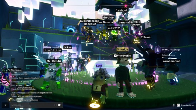 A group of Voyager avatars gather in a vibrant, futuristic arena for the HV-MTL: First Charge challenge in OthersideMeta, with usernames like "freshout," "Tclaws," "Smudgy," and "akmomoniack" displayed above characters including a penguin and a dog-like creature. The chat and player tags confirm the bustling multiplayer scene referenced in the post.