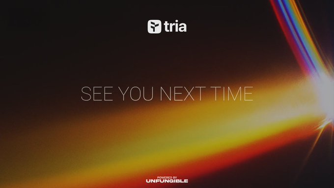 The image features a poster or advertisement that says "See you next time" written in white text against an orange background, with a rainbow-colored light shining from the top right corner of the image. The poster also includes a link to a website called @useTria, which is related to cryptocurrency and blockchain technology.