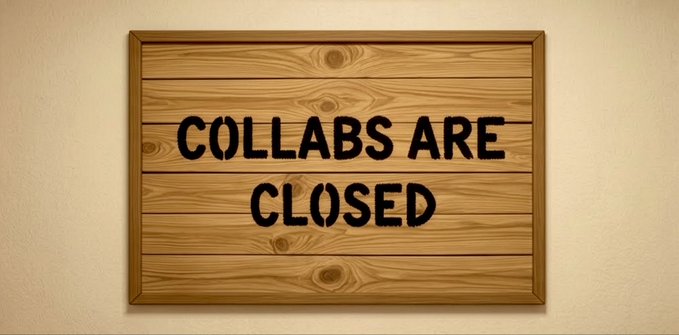 A wooden sign with black lettering that reads 'COLLABS ARE CLOSED' mounted on a beige wall.