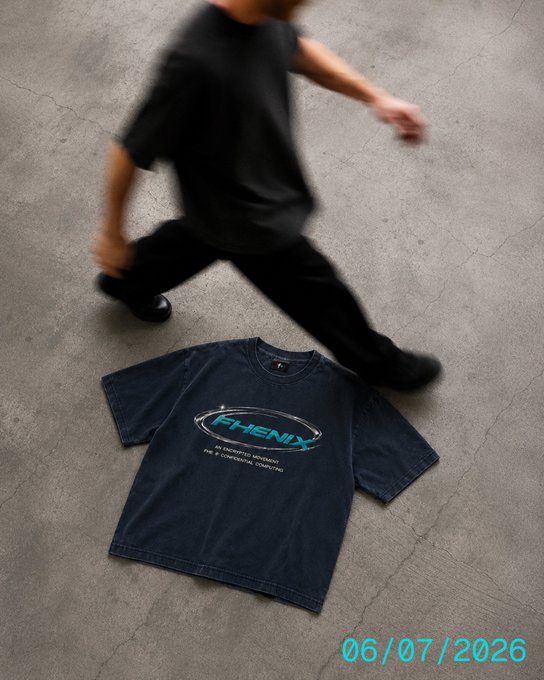 A blurred figure strides past a faded black Fhenix t-shirt laid on cracked concrete, with the date "06/07/2026" stamped in the corner — visual hype for the Fhenix swag shop dropping Monday, 6.07.26.