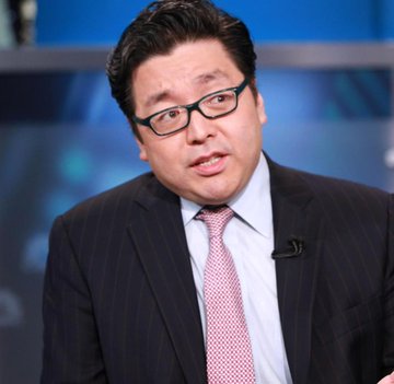 A man with dark hair and glasses, wearing a dark suit with a pink tie, is being interviewed on a blue-toned news set, likely Tom Lee, founder of Fundstrat and BitMine, discussing the company's significant $73 million ($73M) purchase of 42,197 ETH.
