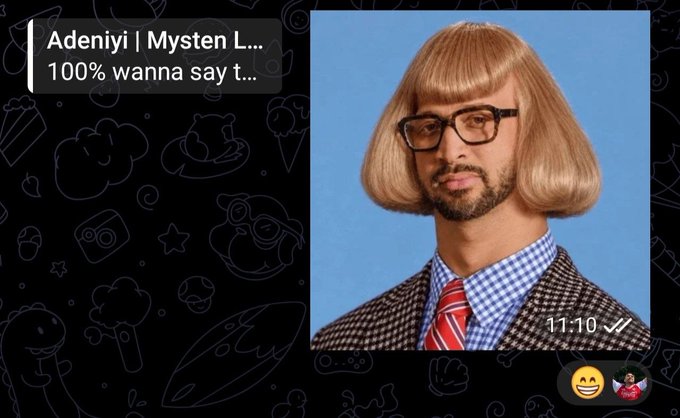 A Snapchat screenshot showing a man in a checkered suit, red tie, and blonde bob wig against a blue background, with text "Adeniyi | Mysten L..." and "100% wanna say t..." and timestamp 11:10.