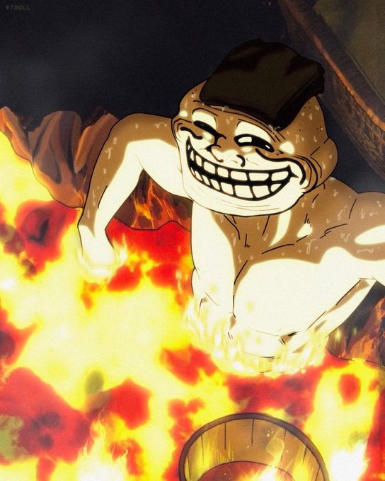A cartoon troll face meme character wearing a black beanie is depicted sweating and grinning maniacally while standing waist-deep in flames.
