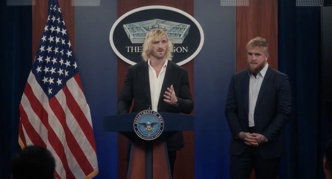 Two men stand at a podium bearing the seal of the President of the United States in front of a Pentagon backdrop and American flag.