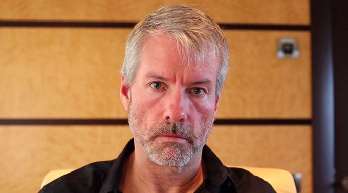 The image features a man with a big, scrunched-up face wearing a black shirt. The man appears to be looking off to the side or something else in his immediate environment. There are no texts or other objects in the image that seem directly related to a specific post or topic of discussion, but the image does have a caption: "BREAKING: Michael Saylor's Strategy just sold 32 $BTC for $2.5M, for the first time since 2022." This caption is associated with an image and does not appear to be directly related to what the man in the picture looks like or is doing; instead, it is about some information that may or may not have any connection to Michael Saylor's strategy or the specific post at hand.