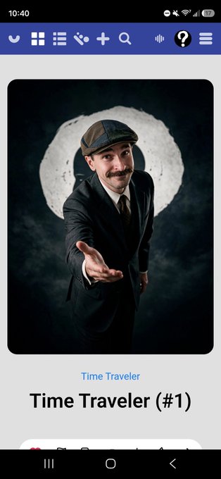 A mobile app screen shows an image of a man with a mustache wearing a suit and flat cap, set against a moon-like background, with the text 'Time Traveler' and 'Time Traveler (#1)' displayed below the image.