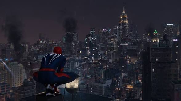 A digital rendering of Spider-Man in a black and red suit, crouching on a water tower and looking out over a sprawling city skyline at night, with smoke rising in the distance.