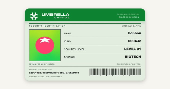A green Umbrella Capital security ID card displaying the name 'bonbon', ID No. '000432', Security Level 'LEVEL 01', and Division 'BIOTECH' with a barcode.