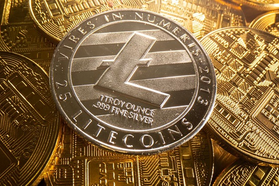 The image features a close-up view of a silver coin with a black stripe, which appears to be a Litecoin. The coin has the words "Litecoins" written on it, indicating that it is a digital currency. The coin is surrounded by other coins in various colors and sizes, suggesting that they are part of a collection or display. The image also includes text that reads "People still underestimate $LTC 14+ years running Fast transactions Low fees Actually used for payments Crypto projects are still chasing narratives Litecoin just keeps doing its job properly". This message emphasizes the importance and value of Litecoins in today's digital landscape, as people continue to rely on them for fast transactions and low fees.