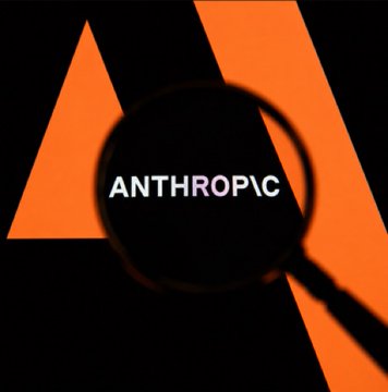 The image displays the Anthropic logo featuring a stylized orange "A" with the company name "ANTHROPIC" in white text, viewed through a magnifying glass against a black background—visually emphasizing the AI company's brand amid news of its soaring $965 billion valuation closing in on Bitcoin's market cap.