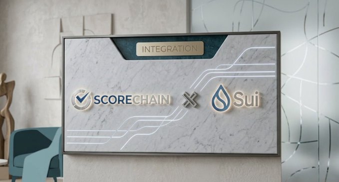 A digital display on a marble stand shows 'INTEGRATION' between 'SCORECHAIN' and 'Sui' (indicated by the Sui water drop logo) in a modern interior setting.