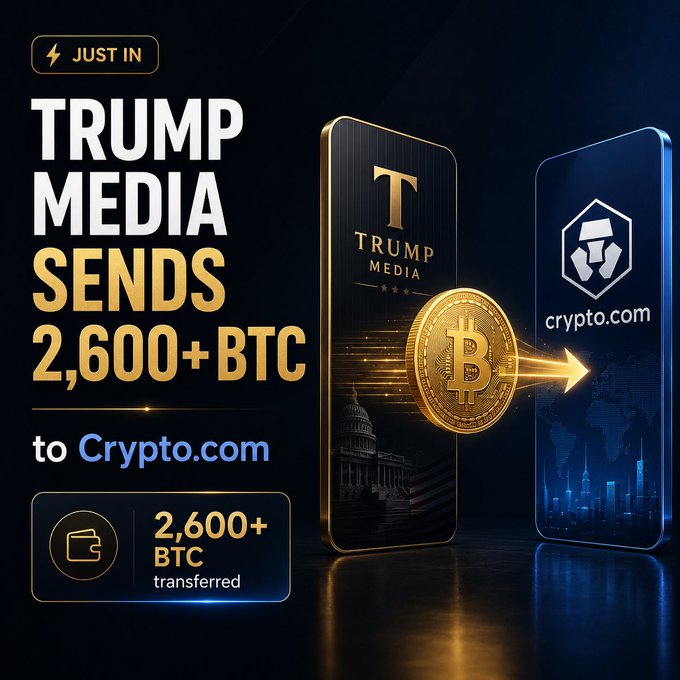 A "JUST IN" news graphic announces "TRUMP MEDIA SENDS 2,600+ BTC to Crypto.com," featuring a 3D illustration of a Bitcoin being transferred from a Trump Media-branded phone to a Crypto.com-branded phone, with a "2,600+ BTC transferred" badge reinforcing the headline about the large Bitcoin transfer.