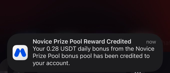 A push notification from an app with a blue 'M' logo reading: 'Novice Prize Pool Reward Credited. Your 0.28 USDT daily bonus from the Novice Prize Pool bonus pool has been credited to your account.'