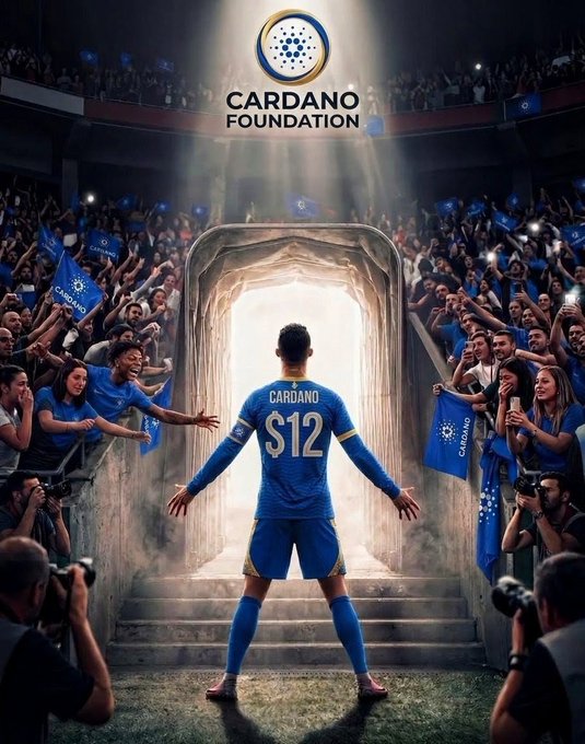 A dramatic AI-generated image showing a soccer player wearing a 'CARDANO S12' jersey emerging from a tunnel into a stadium filled with cheering fans waving Cardano flags under the Cardano Foundation logo.