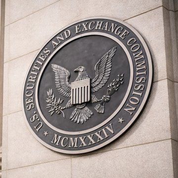The image shows the official seal of the U.S. Securities and Exchange Commission (SEC), featuring an eagle with a shield, olive branch, and arrows, encircled by the text "U.S. SECURITIES AND EXCHANGE COMMISSION" and the Roman numerals "MCMXXXIV" (1934), mounted on a stone building. The seal relates to the accompanying news about the SEC's new proposed framework for crypto investment contracts, as it represents the regulatory body issuing the proposal led by Chair Paul Atkins.