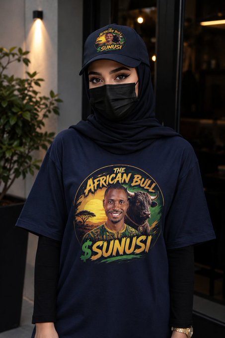 A person wearing a hat and shirt with the "$SUNUSI" logo and "The African Bull" text. The image directly illustrates the "$SUNUSI" token mentioned in the post.