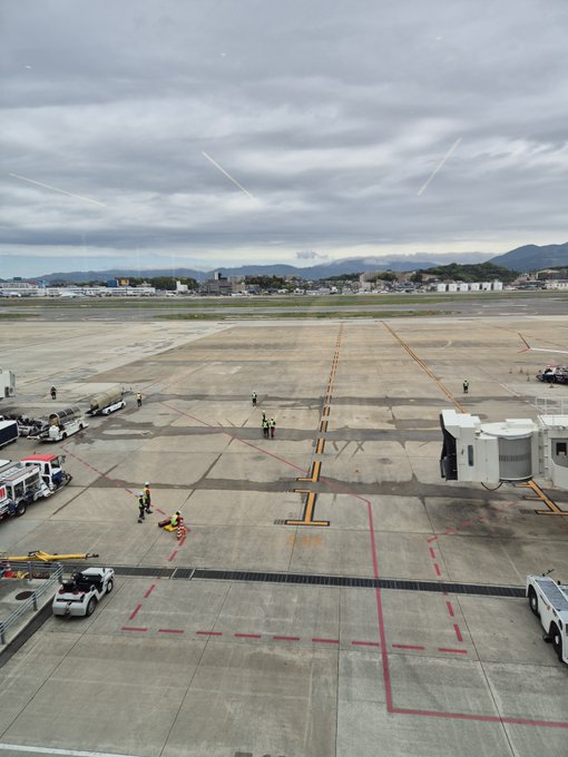 The only text featured in this image is the word FOLEX painted in a yellow background with black lettering. The picture shows an airport tarmac with a number of trucks, vehicles, and workers marking the area as closed. There are no references to GM or "Taco day" in the image suggesting no relation.