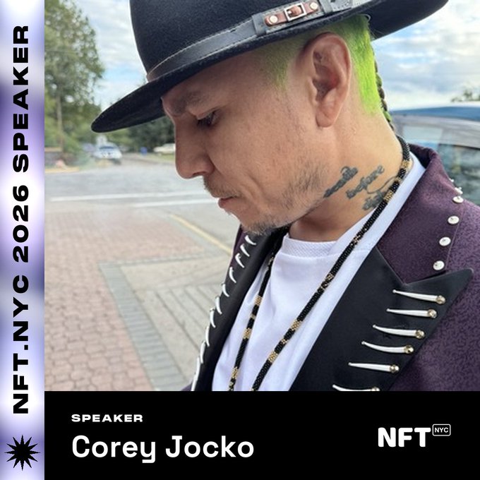 A promotional graphic for NFT.NYC 2026 Speaker, showing a profile photo of Corey Jocko wearing a black hat, studded purple jacket, and with green-dyed hair.
