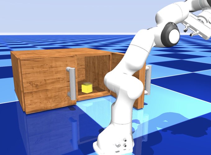 A robotic arm stands in a simulated environment with a blue checkered floor, positioned next to an open wooden cabinet containing a small yellow cube.