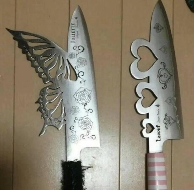 Two ornate stainless steel knives with decorative blades; the left one is labeled 'Juliette' with rose engravings and butterfly wing cutouts, and the right one is labeled 'Lappit' with heart cutouts.