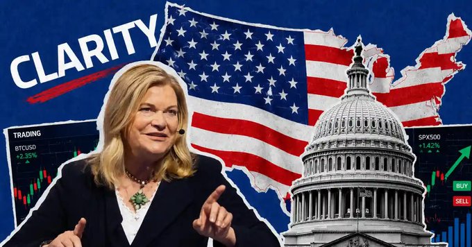 The image features the word "CLARITY" over a U.S. flag and Capitol building backdrop, with a blonde woman speaking and trading charts showing BTCUSD +2.35% and SPX500 +1.42%, visually reinforcing the post's briefing on the CLARITY Act's stalled progress in the Senate.