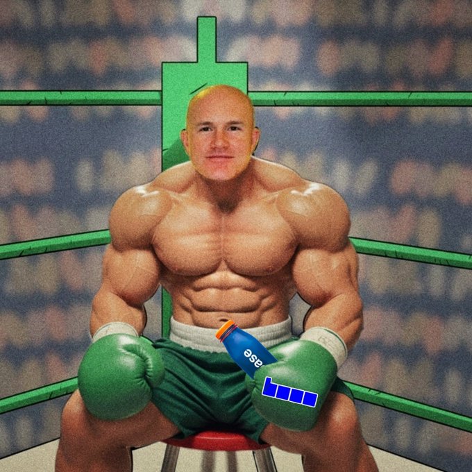 A surreal image of a muscular boxer with a bald head in green boxing gloves sitting in a boxing ring, with an edited "eog" bottle placed in his lap.
