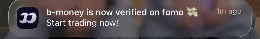A mobile notification from "fomo" announces "b-money is now verified on fomo" with the message "Start trading now!" posted 1 minute ago. The image supports the caption's theme by suggesting that savvy traders should act quickly on newly verified assets before the broader market catches on.