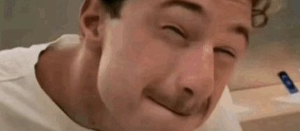 A close-up of a man smiling wryly, appearing skeptical or amused, which visually captures the tone of skepticism in the post expressing doubt about a "megaeth campaign" that was promised to start "one week" ago yet has yet to materialize.