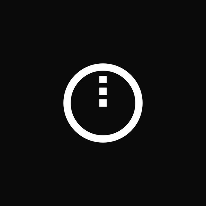 A minimalist icon showing a white circle with three dots arranged vertically inside it, displayed on a black background.