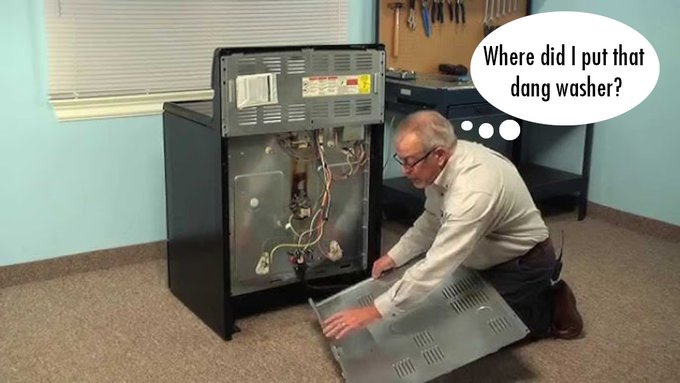 A man kneeling beside a disassembled dryer in a workshop with a thought bubble reading 'Where did I put that dang washer?'.