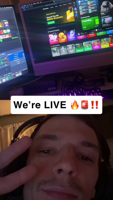 A screenshot of a livestream showing a man with a beard, with the text 'We're LIVE 🔥🚨!!' overlaid, with computer monitors displaying a streaming setup in the background.