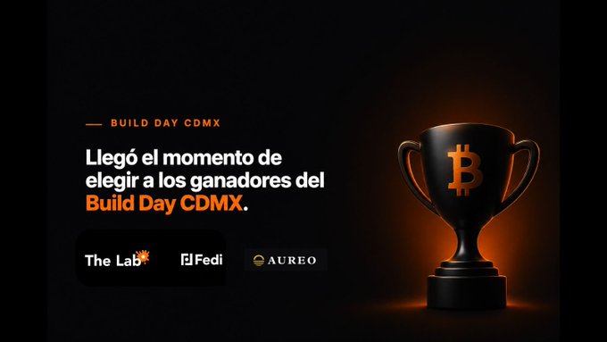 The image features a trophy, likely a gold-colored one with an orange logo or design, placed prominently against a black background. The text "Build Day CDMX" is written above the trophy, indicating that this event is related to Build Day CDMX. Below the trophy, there are two lines of text in Spanish: "La Legla el momento de elegir a los ganadores del Build Day CDMX". This suggests that the image might be promoting an event or competition related to building and architecture, with the trophy symbolizing a successful project or achievement.