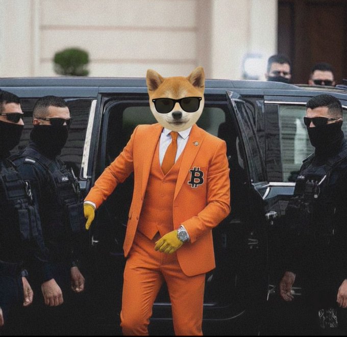 A Shiba Inu dog wearing sunglasses and an orange suit with a Bitcoin 'B' lapel pin steps out of a black vehicle, flanked by two masked security guards in black tactical gear.