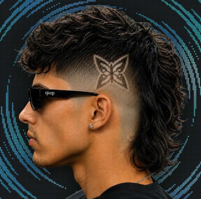 The image features a man with a mohawk hairstyle wearing sunglasses and glasses. The background of the photo has blue swirls that are part of an internet meme or social media post, which includes text such as "quip" and "@quipnetwork". This suggests that the image is related to a discussion about cryptocurrency or a similar online platform.