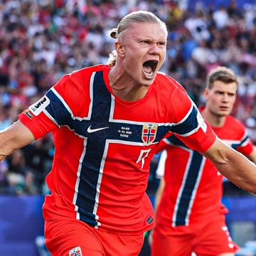 Erling Haaland, wearing Norway's #14 jersey, screams in celebration during a match, likely tied to the high-stakes $600,000 bet placed on under 3 goals in the Brazil vs Norway game on Polymarket.