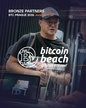 The image features a man wearing glasses standing next to a laptop computer with a mouse. The background of the image has text related to Bitcoin Beach and Bitcoin adoption.